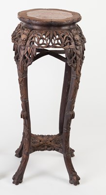 Lot 961 - A Chinese hardwood jardiniere stand with wavy...