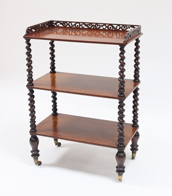 Lot 981 - A Victorian rosewood three-tier whatnot, the...