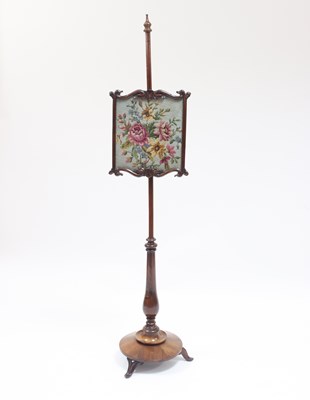 Lot 982 - A William IV rosewood pole screen with scroll...