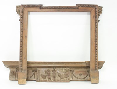 Lot 992 - A pine chimneypiece, the frieze with central...