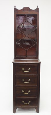 Lot 995 - A narrow mahogany bookcase, the upper section...