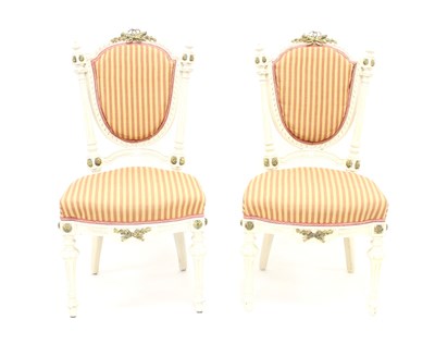 Lot 998 - A pair of French painted salon chairs, each...