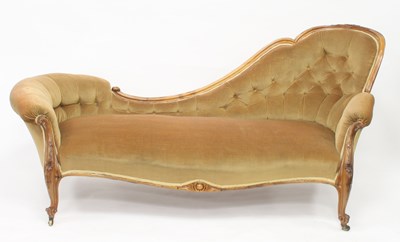 Lot 1000 - A Victorian walnut chaise longue on foliate...