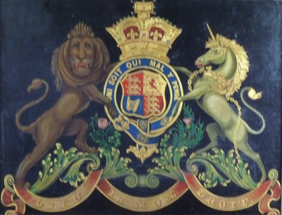 Lot 1146 - An armorial coach or carriage panel, painted...