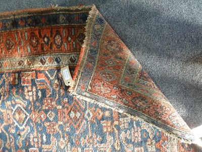 Lot 8 - A Feraghan runner, the geometric blue ground...