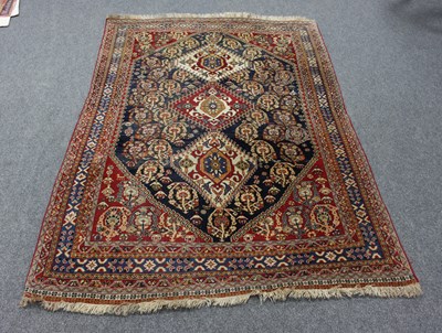 Lot 9 - A Hamadan rug with three pole medallions to...