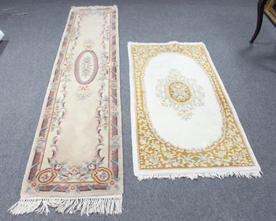 Lot 12 - A Chinese rug, 220cm x 115cm and a Chinese...