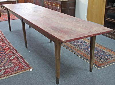 Lot 25 - A French farmhouse table, the planked top on...