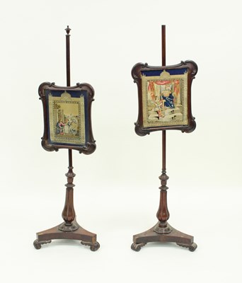 Lot 27 - A near pair of Victorian rosewood pole screens,...