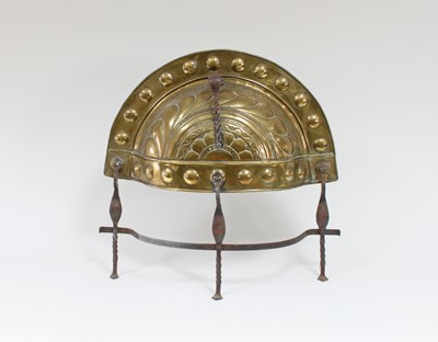 Lot 35 - A brass and steel curfew guard, gadrooned...