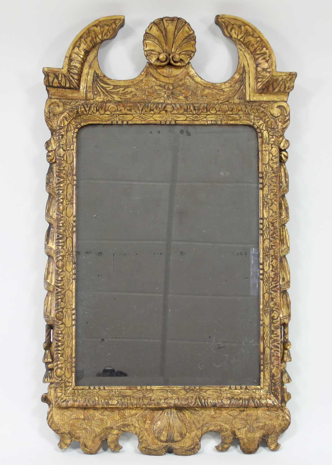 Lot 37 - A George II style carved and gilded wall
