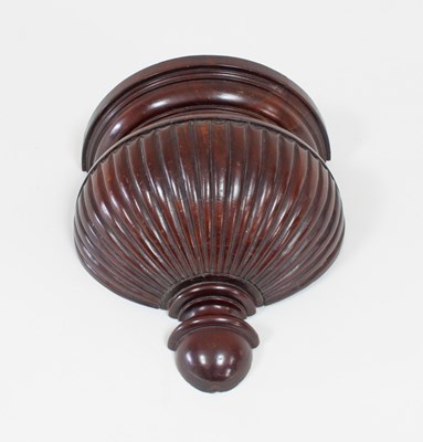 Lot 41 - A carved walnut half-round wall bracket, 24cm...