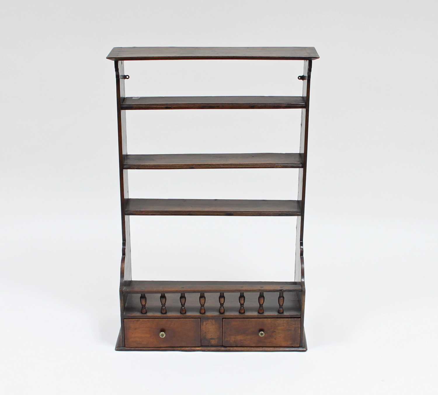 Lot 45 - A 19th Century walnut rack of shelves with...