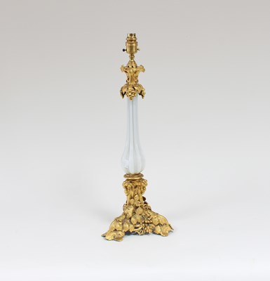 Lot 77 - A gilt metal and opaque glass table lamp, the...