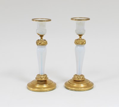 Lot 78 - A pair of gilt metal mounted candlesticks,...