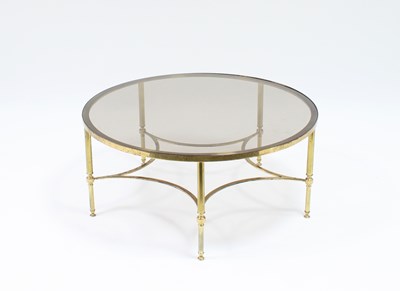 Lot 85 - A circular brass low table with glazed top, on...