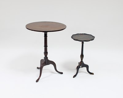 Lot 89 - A mahogany table on a turned column and tripod...