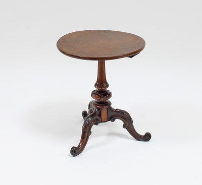 Lot 90 - A circular pollard oak table top on a...