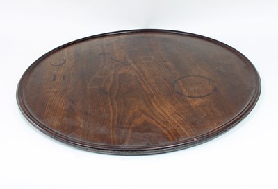 Lot 92 - A circular mahogany tray with dished top, 62cm...