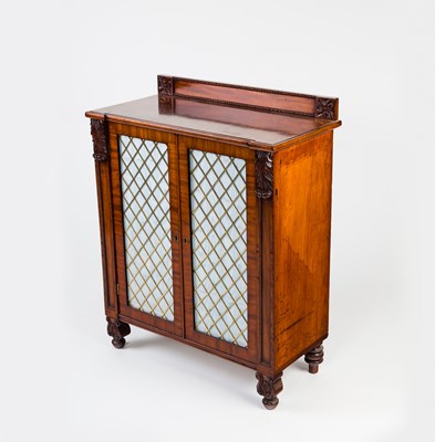 Lot 98 - A Regency mahogany cupboard, the back with...