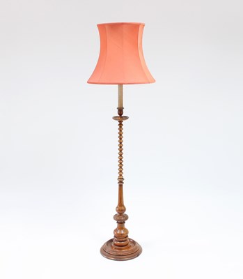 Lot 101 - A turned walnut candlestick with bobbin turned...