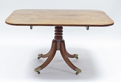 Lot 105 - A Georgian mahogany breakfast table the top...