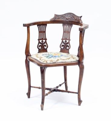 Lot 109 - An Edwardian mahogany corner chair, having...