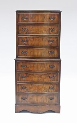 Lot 116 - A figured walnut serpentine front tallboy...