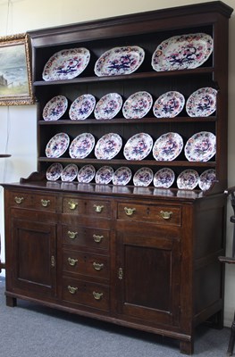 Lot 126 - An oak dresser with shelves over, fitted...