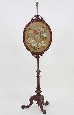 Lot 130 - A Victorian needlework pole screen on a brass...