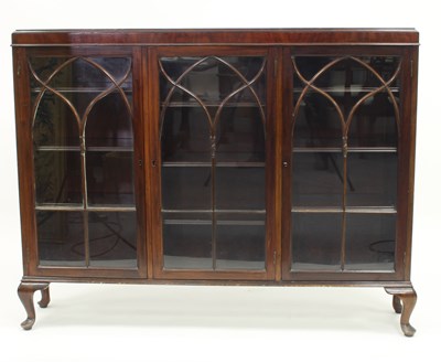 Lot 131 - A mahogany bookcase enclosed by three glazed...