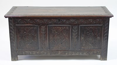 Lot 132 - An 18th Century carved oak chest with hinged...