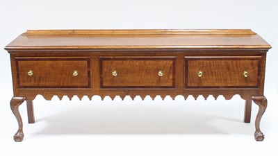 Lot 152 - An oak dresser base, fitted three drawers, the...