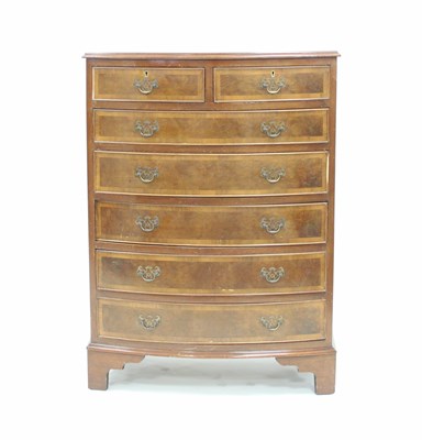 Lot 164 - A burr walnut bowfront chest by Maple, fitted...