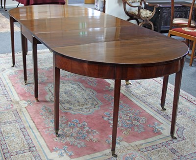 Lot 166 - A George III and later mahogany D-end dining...