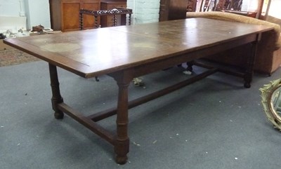 Lot 184 - A 20th Century oak, ash and pine dining table...