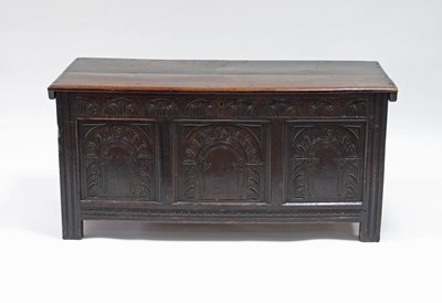 Lot 192 - An 18th Century oak coffer, the planked top...