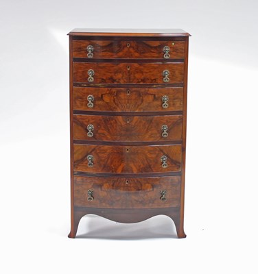 Lot 198 - A walnut veneered bowfront chest of six...