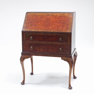 Lot 201 - A Queen Anne style walnut bureau on cabriole...