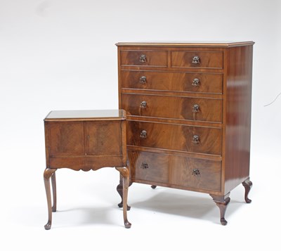 Lot 208 - A walnut veneered chest of two short over four...