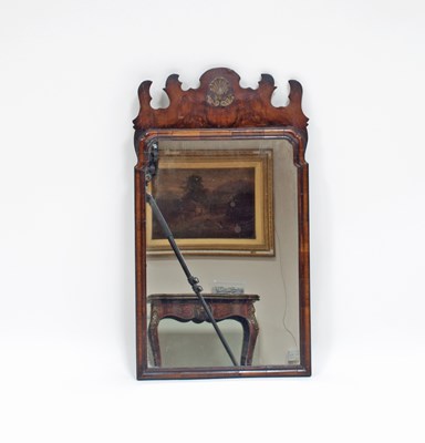 Lot 209 - A George III fret carved walnut framed mirror...