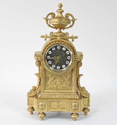 Lot 225 - A French gilt metal mantel clock, the circular...