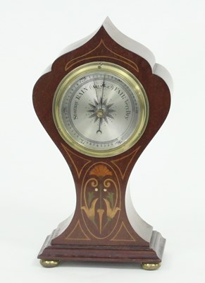 Lot 229 - An Edwardian barometer in an inlaid balloon...