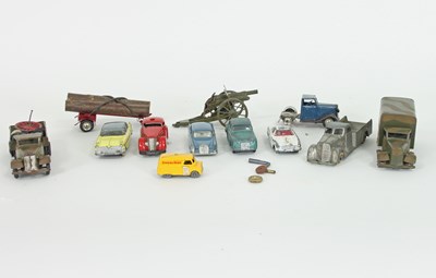 Lot 235 - A small group of tinplate toy cars and related...