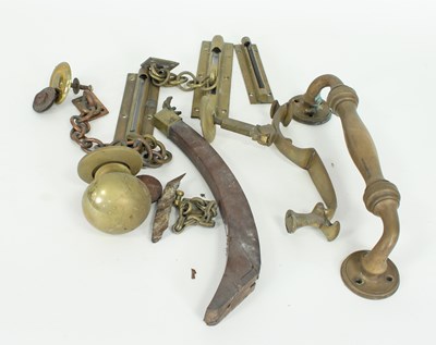 Lot 262 - A brass door handle, a large brass door knob...