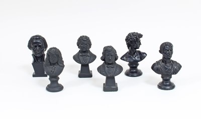 Lot 283 - Six miniature plaster busts all painted black,...