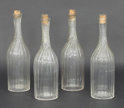 Lot 306 - A set of four spiral fluted carafes, 28cm...