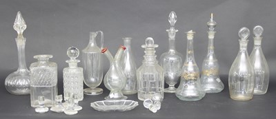 Lot 309 - A collection of twelve glass decanters,...