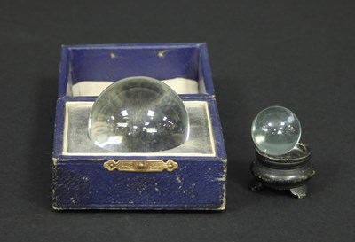 Lot 315 - A crystal ball, 5cm diameter in a box by Two...