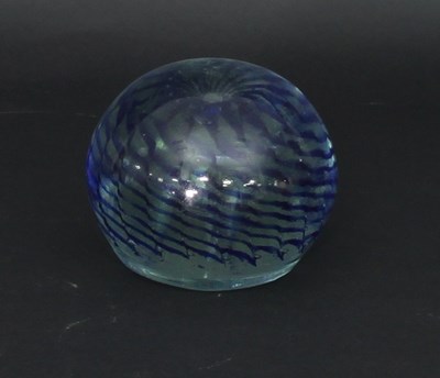 Lot 325 - A trailed blue glass weight, of spherical form